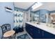 Bright bathroom featuring a modern vanity, stylish decor, and ample lighting at 4614 Sandpointe Dr, New Port Richey, FL 34655