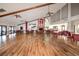 Spacious clubhouse interior featuring a large room, tables, chairs, and high ceilings at 4614 Sandpointe Dr, New Port Richey, FL 34655