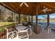Relax in the charming gazebo, complete with ceiling fans and serene lake views at 4614 Sandpointe Dr, New Port Richey, FL 34655