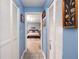 Hallway with built-in storage leading to a bedroom at 4614 Sandpointe Dr, New Port Richey, FL 34655