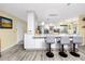 Modern kitchen featuring a large island with counter seating and pendant lighting at 4614 Sandpointe Dr, New Port Richey, FL 34655