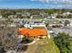 Aerial view of the property highlighting the orange roof, fenced yard, and neighborhood at 5125 34Th N Ave, St Petersburg, FL 33710