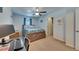 Comfortable bedroom featuring carpeted floors and a light wooden bed frame at 5312 Sylvester Loop, Tampa, FL 33610