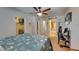 Bedroom with carpet, ceiling fan, and access to closet and bathroom at 5312 Sylvester Loop, Tampa, FL 33610