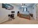 Cozy bedroom with a ceiling fan, carpeted floor and a wooden bed frame at 5312 Sylvester Loop, Tampa, FL 33610
