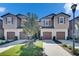 Charming townhomes with attached garages, manicured lawn and beautiful landscaping at 5312 Sylvester Loop, Tampa, FL 33610