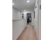 Bright hallway with carpet flooring leading to bedroom, and neutral wall colors at 5312 Sylvester Loop, Tampa, FL 33610