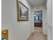 The hallway with neutral colors and carpet flooring offers bedroom views at 5312 Sylvester Loop, Tampa, FL 33610