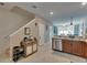Bright kitchen features a breakfast bar, stainless appliances and open layout to the living spaces at 5312 Sylvester Loop, Tampa, FL 33610