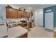 Traditional kitchen features stainless steel appliances, tile flooring and wooden cabinetry at 5312 Sylvester Loop, Tampa, FL 33610