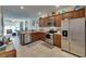 Well-equipped kitchen with stainless steel appliances and wood cabinetry at 5312 Sylvester Loop, Tampa, FL 33610
