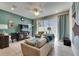 Bright living room with tile floors, ceiling fan, and sliding glass doors at 5312 Sylvester Loop, Tampa, FL 33610