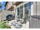 Cozy outdoor patio featuring a grill, comfortable seating, and privacy fence at 5312 Sylvester Loop, Tampa, FL 33610