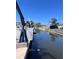 A peaceful canal view showcasing the waterfront and a bright blue sky at 590 Baywood N Dr, Dunedin, FL 34698