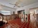 Open room awaiting remodel, featuring tile floors and an open staircase at 590 Baywood N Dr, Dunedin, FL 34698