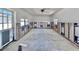 Bright room awaiting remodel featuring tile floors, a rear entrance and bright light from two windows at 590 Baywood N Dr, Dunedin, FL 34698