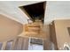 Interior view of attic access with pull-down stairs at 6042 Countryman Ln, New Port Richey, FL 34652