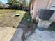 Backyard with green grass, an A/C unit, and a green septic tank lid at 6042 Countryman Ln, New Port Richey, FL 34652
