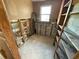 Bathroom being remodeled with new pipes, a window, and shelves at 6042 Countryman Ln, New Port Richey, FL 34652