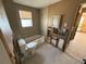 View of bathroom area featuring a toilet, tub, and window, awaiting remodeling at 6042 Countryman Ln, New Port Richey, FL 34652