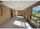 Spacious living room with tile floors, a back door, and multiple windows at 6042 Countryman Ln, New Port Richey, FL 34652