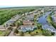 Spacious home with a beautiful backyard and canal, surrounded by lush greenery and mature trees at 613 Manns Harbor Dr, Apollo Beach, FL 33572