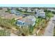 Aerial view showcasing a beautiful home, manicured landscaping, and the canal-front community at 613 Manns Harbor Dr, Apollo Beach, FL 33572