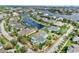 Aerial view shows a vibrant neighborhood with canal access and well-maintained homes at 613 Manns Harbor Dr, Apollo Beach, FL 33572
