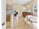 Spacious bathroom featuring a shower, tub, double sink vanity, and access to the main bedroom at 613 Manns Harbor Dr, Apollo Beach, FL 33572