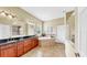 Luxurious bathroom with a large tub, double vanity sinks, and a separate shower area at 613 Manns Harbor Dr, Apollo Beach, FL 33572