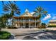 Exterior shot of the community clubhouse in neutral colors with manicured landscaping at 613 Manns Harbor Dr, Apollo Beach, FL 33572