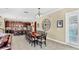 Elegant dining room with large dining table, connected to the kitchen for easy entertaining at 613 Manns Harbor Dr, Apollo Beach, FL 33572