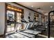 Well-equipped gym with multiple modern treadmills and workout equipment at 613 Manns Harbor Dr, Apollo Beach, FL 33572