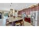 Spacious kitchen with a large island, stainless steel appliances, and ample cabinet space at 613 Manns Harbor Dr, Apollo Beach, FL 33572