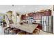Spacious kitchen with a large island, stainless steel appliances, and ample cabinet space at 613 Manns Harbor Dr, Apollo Beach, FL 33572