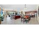 Bright, open living space with a seamless flow between kitchen, dining, and living room areas at 613 Manns Harbor Dr, Apollo Beach, FL 33572