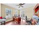 Bright home office with a large desk and a view to the balcony, ideal for remote work at 613 Manns Harbor Dr, Apollo Beach, FL 33572