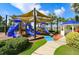 Fun playground with slides and covered area, ideal for entertainment at 613 Manns Harbor Dr, Apollo Beach, FL 33572