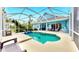 Inviting screened-in pool with a spacious patio, perfect for outdoor entertaining and relaxation at 613 Manns Harbor Dr, Apollo Beach, FL 33572