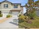 A well-maintained two-story townhome with a single-car garage, manicured landscaping, and a welcoming facade at 6930 Ripple Pond Loop, Zephyrhills, FL 33541