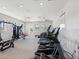 Well-equipped fitness center with modern treadmills, exercise machines, and natural light for a healthy lifestyle at 6930 Ripple Pond Loop, Zephyrhills, FL 33541