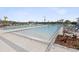 Expansive community pool with ample lounge chairs, perfect for sunbathing and socializing at 6930 Ripple Pond Loop, Zephyrhills, FL 33541