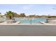 Resort-style pool with large planters and shallow entry points, ideal for relaxation and leisure at 6930 Ripple Pond Loop, Zephyrhills, FL 33541