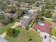 Bird's-eye view of the home revealing its layout, pool, and manicured lawn in a tranquil residential setting at 8518 Delaware Dr, Weeki Wachee, FL 34607