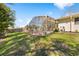 Expansive backyard featuring a screened-in pool area with plenty of space for outdoor activities and entertaining at 8518 Delaware Dr, Weeki Wachee, FL 34607