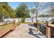 Backyard with a wooden dock, wooden handrails and stairs surrounded by mulch at 8518 Delaware Dr, Weeki Wachee, FL 34607