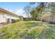 A spacious backyard enclosed by a wooden fence, offering privacy and a great space for outdoor activities at 8518 Delaware Dr, Weeki Wachee, FL 34607