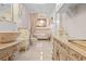 An elegant bathroom with a soaking tub, vessel sink, and a decorated vanity for storage at 8518 Delaware Dr, Weeki Wachee, FL 34607
