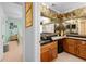 A bedroom leads to a luxurious bathroom with wood cabinets and a large, framed mirror at 8518 Delaware Dr, Weeki Wachee, FL 34607