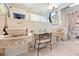 A stylish bathroom features double vessel sinks, tile backsplash, and a vanity area with chair at 8518 Delaware Dr, Weeki Wachee, FL 34607